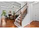 Welcoming living room and staircase with coffered ceilings and lots of natural light at 6175 Beaver Crossing Dr, Cumming, GA 30040