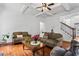 Spacious living room with coffered ceilings, hardwood floors, and staircase access at 6175 Beaver Crossing Dr, Cumming, GA 30040