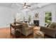 Inviting living room with fireplace, coffered ceilings, and view to the backyard at 6175 Beaver Crossing Dr, Cumming, GA 30040