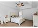 Bright main bedroom with an elegant ceiling fan, and ample space for personalized décor at 6175 Beaver Crossing Dr, Cumming, GA 30040