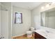 Bathroom featuring a single sink vanity, toilet, and shower-tub combo at 1610 Kenilworth Se Ln, Conyers, GA 30013