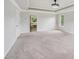 Empty carpeted bedroom with door leading to bathroom at 1610 Kenilworth Se Ln, Conyers, GA 30013