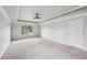 Bedroom with carpet, tray ceiling, and window at 1610 Kenilworth Se Ln, Conyers, GA 30013