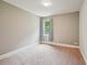 This bedroom is carpeted and has a window at 1610 Kenilworth Se Ln, Conyers, GA 30013
