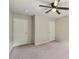 Bedroom with a ceiling fan and two closets for lots of storage at 1610 Kenilworth Se Ln, Conyers, GA 30013