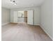 Large bonus room featuring an opening to the loft and plush carpeting at 1610 Kenilworth Se Ln, Conyers, GA 30013