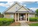 Community clubhouse exterior with visible pool hours and relevant community information at 1610 Kenilworth Se Ln, Conyers, GA 30013