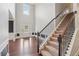 Grand foyer with soaring ceilings, elegant staircase, and natural light streaming through the front door at 1610 Kenilworth Se Ln, Conyers, GA 30013