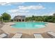 Community swimming pool with lounge chairs, tables, and various seating options at 1610 Kenilworth Se Ln, Conyers, GA 30013