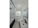 Bathroom with new fixtures, a shower and bathtub with a shower curtain next to a window with natural light at 167 Garden Ln, Decatur, GA 30030