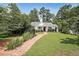 Charming single story home with manicured lawn and brick walkway at 167 Garden Ln, Decatur, GA 30030