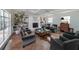 Bright, large living room with fireplace, many seating options and hardwood floors at 167 Garden Ln, Decatur, GA 30030