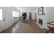 Cozy living room with white walls, fireplace, and hardwood floors at 167 Garden Ln, Decatur, GA 30030