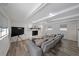 Bright living room featuring a large sectional sofa and white brick fireplace at 167 Garden Ln, Decatur, GA 30030