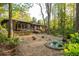 Stunning backyard with pond surrounded by mature trees at 1850 Winchester Trl, Brookhaven, GA 30341