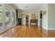 Open living room with hardwood floors, French doors, and ample natural light at 1850 Winchester Trl, Brookhaven, GA 30341