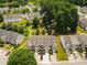 Overhead shot of townhomes boasting manicured lawns, mature trees, and private driveways in a well-kept community at 2776 Snapfinger Mnr # 2776, Decatur, GA 30035