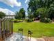 Landscaped backyard featuring a lush lawn, mature trees, and a patio area at 2776 Snapfinger Mnr # 2776, Decatur, GA 30035