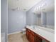 Bright bathroom featuring a white sink, large mirror, and a clean shower-tub combination at 2776 Snapfinger Mnr # 2776, Decatur, GA 30035
