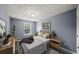 Comfortable bedroom is staged with contemporary decor and neutral color palette at 2776 Snapfinger Mnr # 2776, Decatur, GA 30035