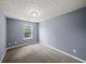 Bedroom featuring neutral carpeting, fresh paint, and a window offering natural light at 2776 Snapfinger Mnr # 2776, Decatur, GA 30035
