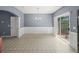 Open dining area with sliding glass doors to patio and traditional white wainscoting at 2776 Snapfinger Mnr # 2776, Decatur, GA 30035
