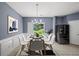 Contemporary dining room features modern decor, stylish chairs, and backyard view at 2776 Snapfinger Mnr # 2776, Decatur, GA 30035