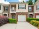 Charming multi-level townhome with brick accents, attached garage, and well-maintained landscaping at 2776 Snapfinger Mnr # 2776, Decatur, GA 30035