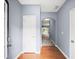 Bright hallway with hardwood floors, archway, and neutral paint, creating a welcoming entry at 2776 Snapfinger Mnr # 2776, Decatur, GA 30035