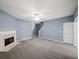 Large living room with a fireplace, light gray walls, and ample carpeted space at 2776 Snapfinger Mnr # 2776, Decatur, GA 30035