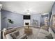 Cozy living room with fireplace, ceiling fan, and comfortable seating at 2776 Snapfinger Mnr # 2776, Decatur, GA 30035