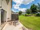 Outdoor patio with furniture overlooks a lush green lawn and well-maintained landscaping at 2776 Snapfinger Mnr # 2776, Decatur, GA 30035