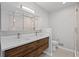 Modern bathroom featuring a double vanity, a glass-enclosed shower, and sleek fixtures at 1279 Colony Pl, Marietta, GA 30068