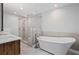 Modern bathroom featuring a standalone tub, a glass-enclosed shower, and sleek fixtures at 1279 Colony Pl, Marietta, GA 30068