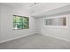Bedroom with large windows offering wooded views and a built-in mirror at 1279 Colony Pl, Marietta, GA 30068