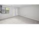 Neutral bedroom with plush carpet, closet, and bright window at 1279 Colony Pl, Marietta, GA 30068