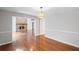 View into the living room with a stone fireplace from the dining room at 1279 Colony Pl, Marietta, GA 30068