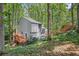 Back exterior of home with a wooded backyard and decks at 1279 Colony Pl, Marietta, GA 30068