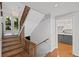 Inviting foyer with hardwood floors, staircase, and kitchen view at 1279 Colony Pl, Marietta, GA 30068