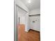 Convenient laundry area with hardwood floors, storage shelf and laundry connections at 1279 Colony Pl, Marietta, GA 30068