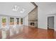View of a living room with hardwood floors and a stone fireplace at 1279 Colony Pl, Marietta, GA 30068