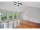 Bright living room with large windows offering great views of the surrounding trees and nature at 1279 Colony Pl, Marietta, GA 30068