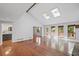 Open-concept living space with hardwood floors, skylights, and a modern design at 1279 Colony Pl, Marietta, GA 30068