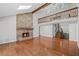 Spacious living room featuring hardwood floors, a stone fireplace, and natural light at 1279 Colony Pl, Marietta, GA 30068