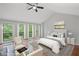 Staged primary bedroom with wooded views, vaulted ceilings, and neutral decor at 1279 Colony Pl, Marietta, GA 30068