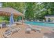 Community pool with lounge chairs, a wooden deck and a covered picnic table at 1279 Colony Pl, Marietta, GA 30068