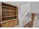 Stylish staircase with wooden accents adjacent to a built-in bookshelf at 1279 Colony Pl, Marietta, GA 30068