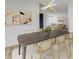 Dining area with sleek table connecting to living room, filled with natural light at 2575 Peachtree Ne Rd # 15F, Atlanta, GA 30305