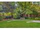 Green space with natural foliage, trees and stone walk ways at 2575 Peachtree Ne Rd # 15F, Atlanta, GA 30305