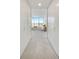 Hallway view of the bedroom, showcasing closet space and natural light from the large windows at 2575 Peachtree Ne Rd # 15F, Atlanta, GA 30305